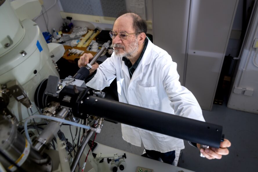 Scientist loading a sample into the cryo-EM equipment