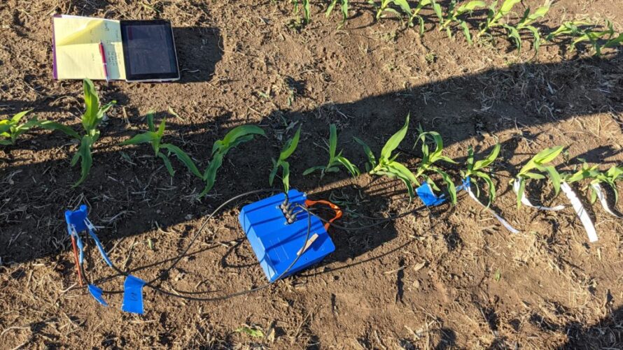 Sensing technology sitting on a crop field.