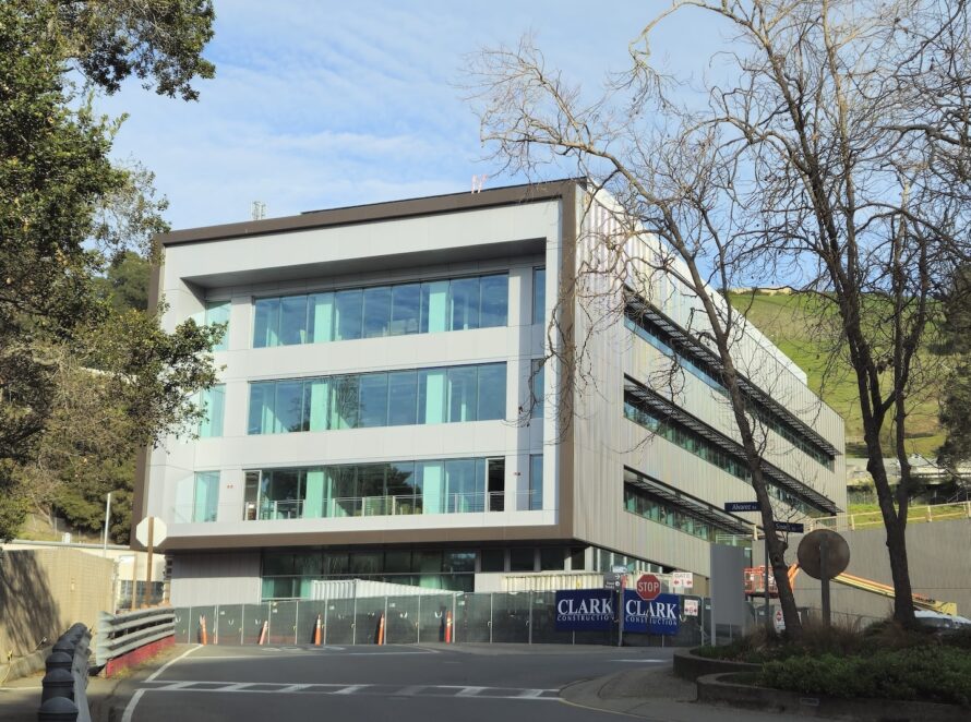 front view of a square building with glass windows