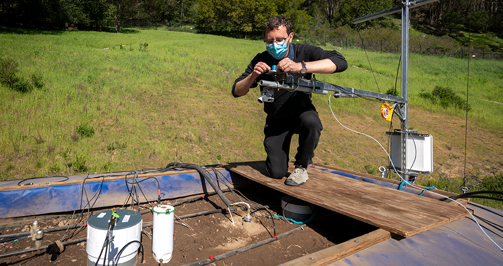 Photo of a researcher working at the SMART Soils Testbed at Berkeley Lab. 
